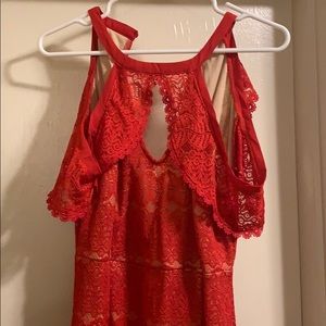 Red dress with off the shoulder sleeves.